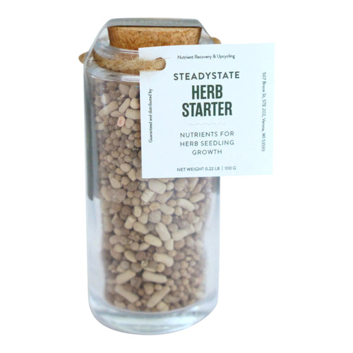 Herb starter fertilizer in a 3.4 oz glass jar with cork lid